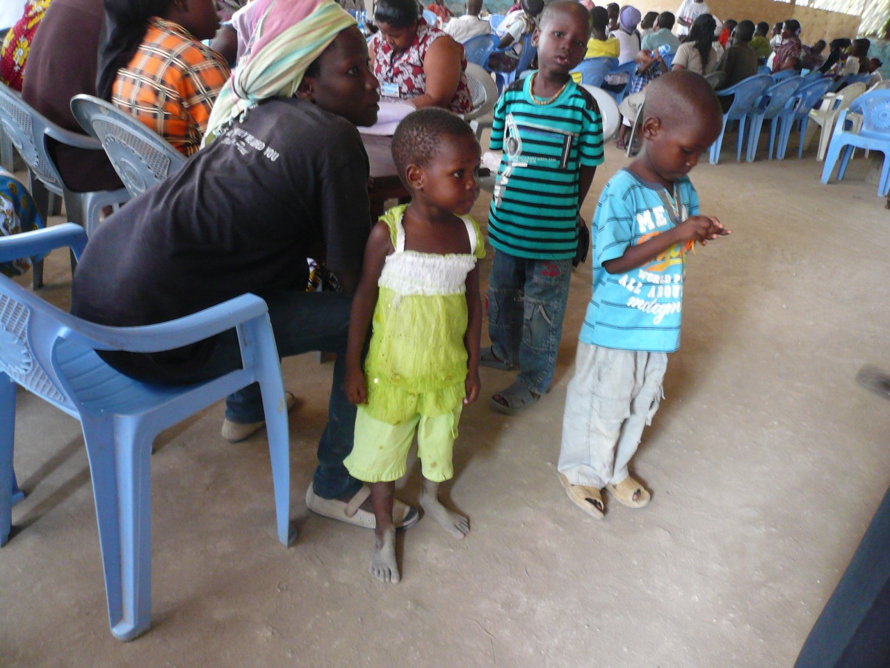 Kids waiting with parents to receive medical aid